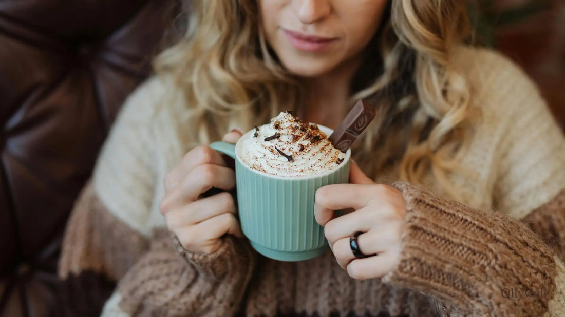 A woman holding a mug of cocoa.